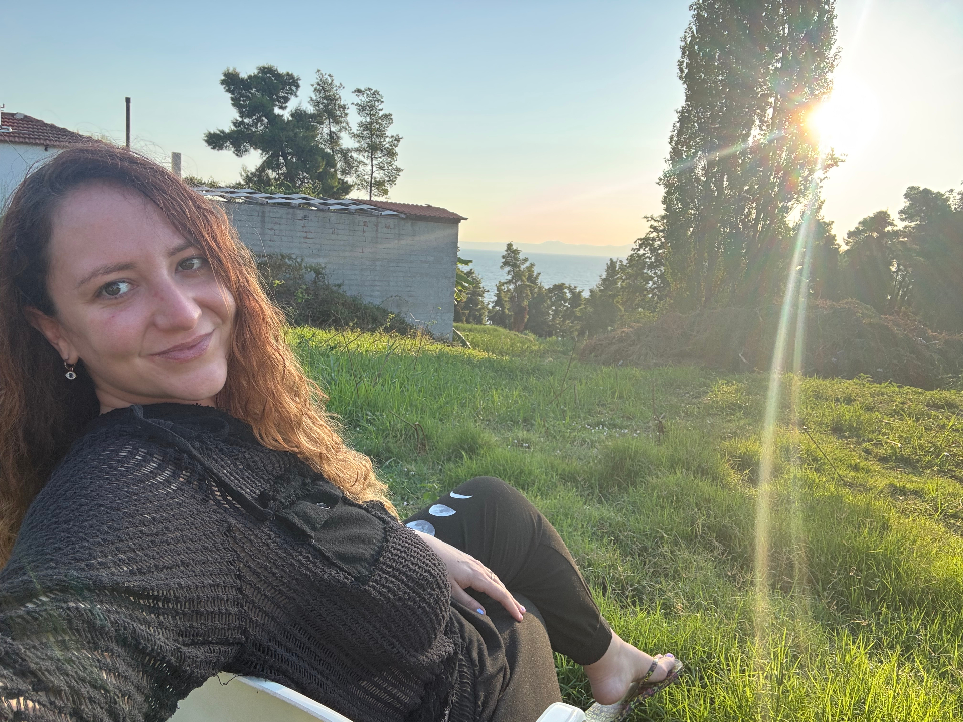 Christina Anthemides-Kelley birdwatching in a meadow above Kriopigi at dawn, near her house in the Amparoudes